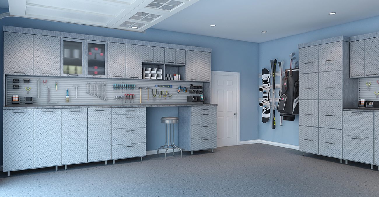 Industrial style garage system with textured steel cabinetry, omni track storage for seasonal sports gear, and slatwall organizer for tools.