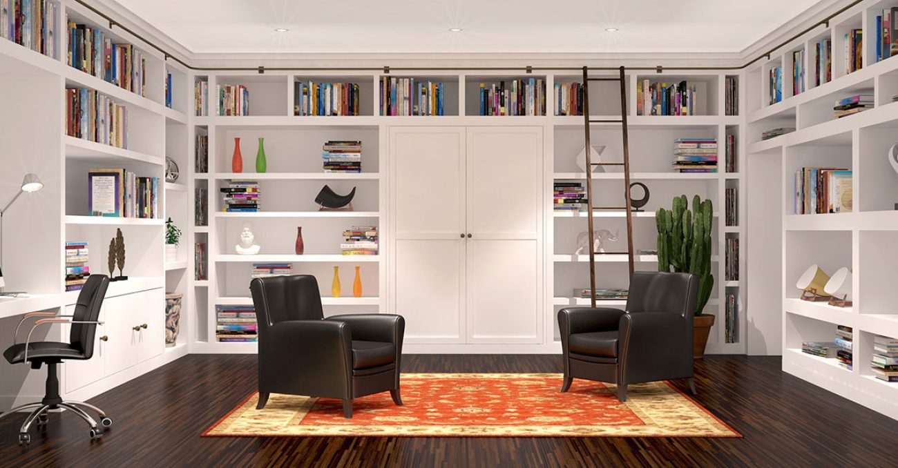 Custom wraparound floor-to-ceiling library shelving with built-in desk, crown molding, and a rolling ladder system.