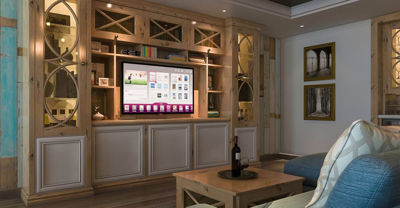 Entertainment center featuring integrated TV nook, display shelving with overhead lighting, and lower concealed cabinets for storage