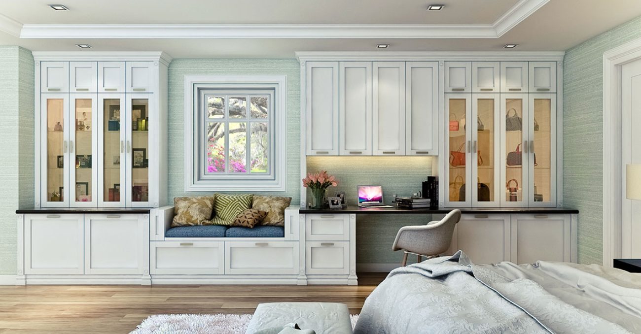 White shaker wall unit with built-in window seat and work station.