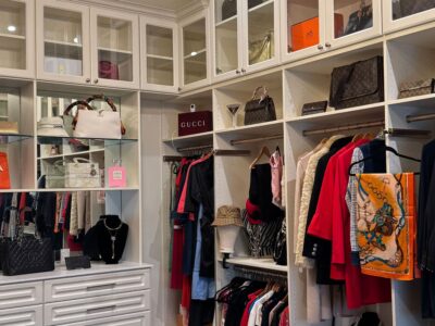 custom walk in closet with a mirror